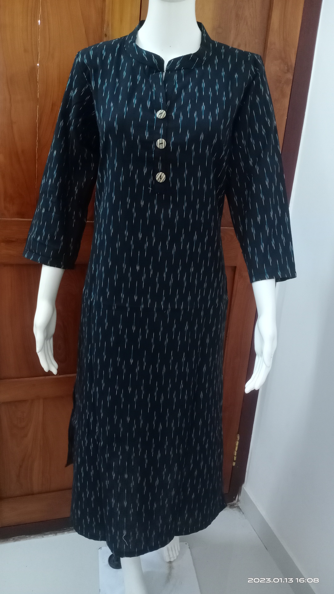 Black Ikkat Kurti with small blue white lines.