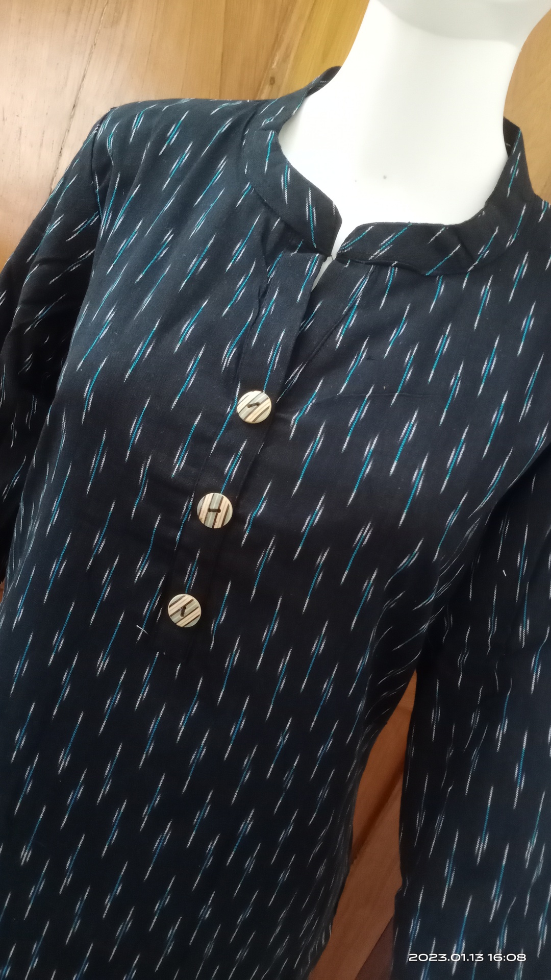 Black Ikkat Kurti with small blue white lines.